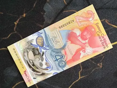 Обява: Банкнота - Източни Кариби - 2 долара (юбилейна) UNC | 2023г.
