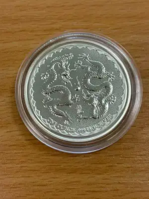 Снимка за обява „Ниуе 2018 - 2 долара - Два дракона, 1 OZ - Сребърна монета"