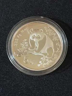 Снимка за обява „Китай 1993 - 5 юана - Панда - Сребърна монета 1/2 OZ“